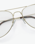 Gold-framed eyeglasses on a white background